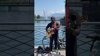 A guitarist in Geneva. #quitar #geneva #lake #bicycle #switzerland