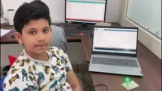 student explaining about arduino project using touch sensor