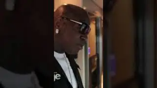 Birdman's brother Slim looking at his Bling Bling