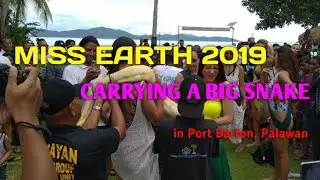 MISS EARTH 2019 CARRYING A BIG SNAKE IN PORT BARTON, PALAWAN