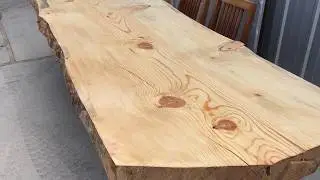 Live edge pine slab table with steel I-beam base by Dumonds.com