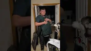Jordan opening his high school lettermen's jacket.
