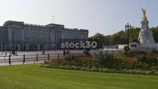 Wide Shot Of Buckimgham Palace And Victoria Memorial Statue In London, UK