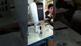 Electric snap button attaching machine