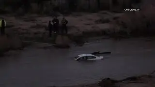 HESPERIA Authorities Respond To Car Fully Submerged in Flood Waters