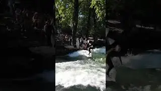 Surfing in the center of Munich Eisbachwelle River #4k #munichtours #adventure #surfing #city