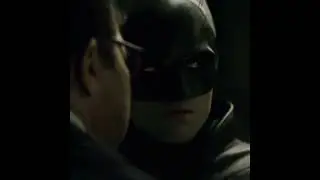 The Batman punches Jim Gordon