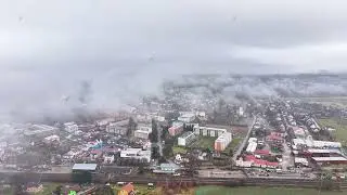 Aerial view of industrial town edge warehouses and factory roofs logistics planner mapping