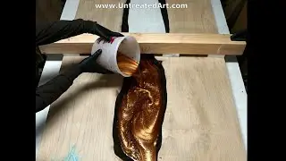 Epoxy pour on burnt live edge copper Maple river door