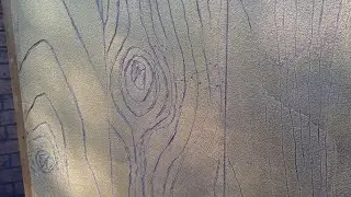 Decorative plaster door. Imitation of wood structure.
