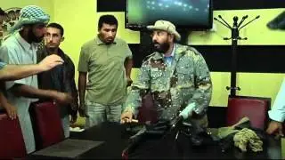 GADDAFI GUNS: Libyan commander shows off dictator's weapons