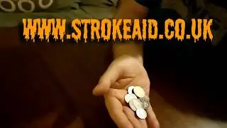 Stroke survivor showing coin exercise #2