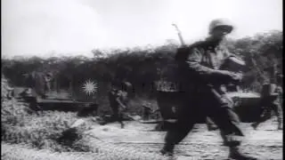 US Naval guns fire at coastal installations and troops advance inland on Biak Isl...HD Stock Footage