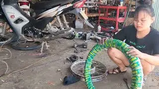 A skilled young woman from the countryside successfully repaired a motorbike for her neighbor.
