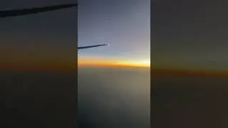 Sunset over clouds #shorts #travel #travelling #sunset #youtubeshorts #plane #flight #flying #sky