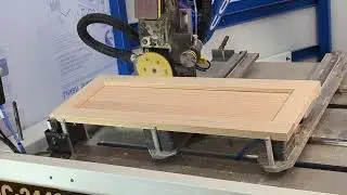 Stolbek Machines CosmoSC sanding a raw door