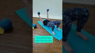 Shoulder Bridge with Arm Weights.