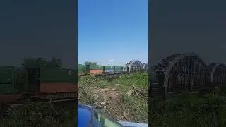Bnsf train crossing Missouri River on an old rusty bridge