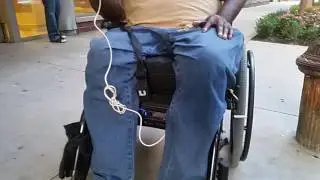 Pimp My Wheelchair!  Man installed a stereo, speaker, and even a USB for the phone! So cool.