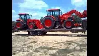 Brute trailers Sliding axle trailer with kubota tractors