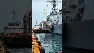 The silent dance of maritime giants coordinating a complex engineering