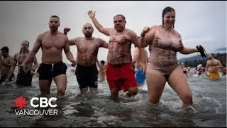 Thousands take the plunge for Vancouver's traditional Polar Bear Swim