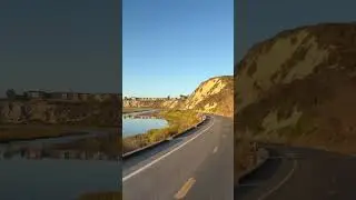 Kids bike mounted on a Kuat NV 2.0 on the Rivian R1S and biking through the Back Bay Loop in Newport