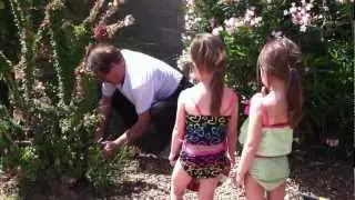 The Girls Helping Grandpa Repair a Broken Drip Hose