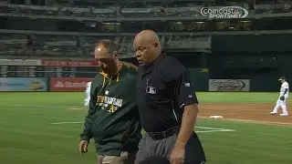TEX@OAK: Umpire Danley hit by foul, later leaves game