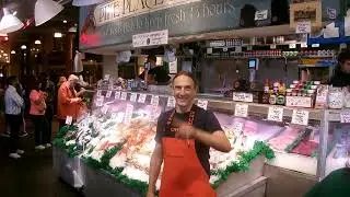 A FLYING FISH AT THE PIKE PLACE MARKET IN SEATTLE PIKE PLACE FISH MARKET