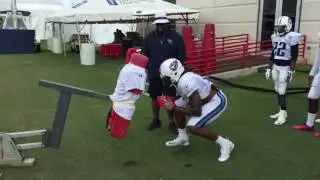 Titans RB Derrick Henry being coached on how to block in the NFL