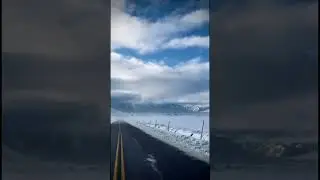 Magical Winter Escape: Scenic Road with Snow-Covered Surroundings