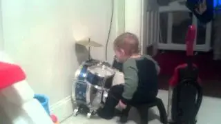 Logan playing the drums