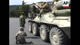 Russian soldiers near Gori, smoke rising