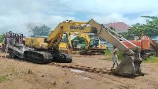 Cara Operator Komatsu Menurunkan Alat Dari Tronton