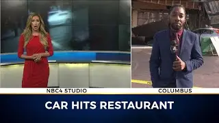 Car crashes into pizza shop