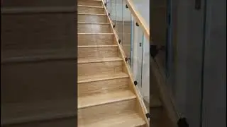 oak and glass staircase balustrade, with black clamps and post caps