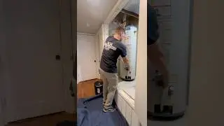 lifting a hot water heater like a man