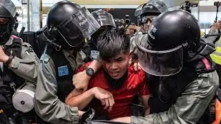 Hong Kong protesters stage violent rally at shopping centre