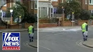 Ice block falls from sky, nearly striking shocked passersby