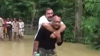 BJP MLA Takes Piggyback Ride To A Boat During Assam Floods