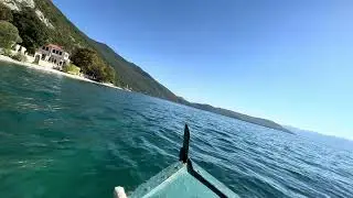 Driving with boat on Ohrid Lake - from Trpejca to Zaum