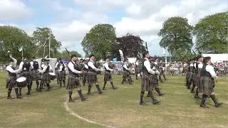 Buchan Peterson Pipe Band march off after Grade 1 competition during 2023 Aberdeen Highland Games