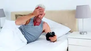 Tired Man Waking Up And Looking At His Alarm Clock - Stock Footage from Videohive
