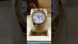Rolex President DayDate 18k solid gold with a stunning white Roman dial