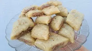 مقروض ابيض باللوز بنة و هشاشة يذوب في الفم