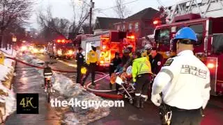 4K UHD - Emergency crews performing CPR while moving a stretcher
