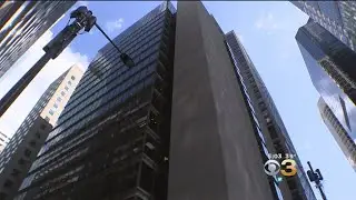 People Try To Avoid Chunks Of Ice Falling From Center City Buildings