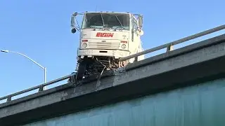 Street sweeper hangs over side of westbound Highway 50 in Sacramento