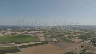 D-Log M. Tevfikiye, Turkey. Surrounding Ancient city of Troy agricultural fields and the Dardanel...